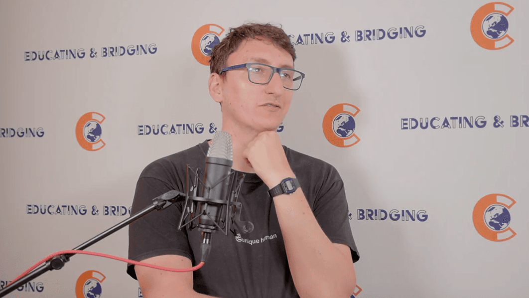 Podcast guest speaking into a microphone